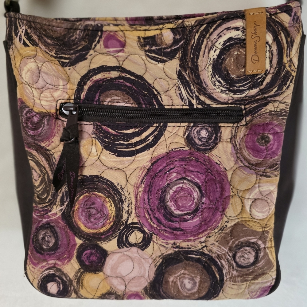 Donna Sharp "Expression" Becki crossbody featuring a quilted circular batik